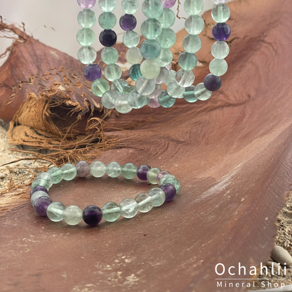 Fluoriet groen-paars armband 8mm