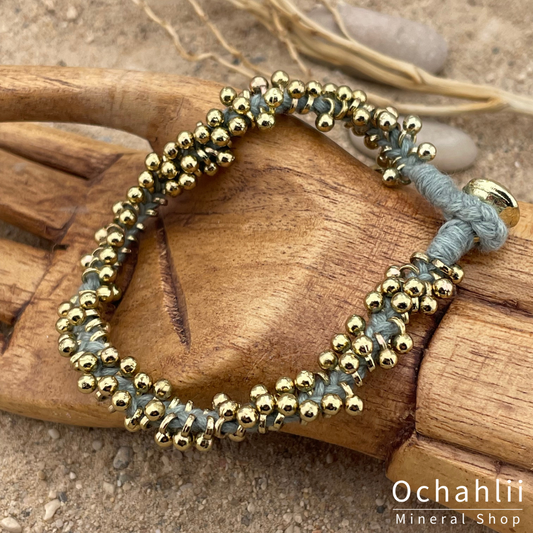 Pulsera étnica color dorado/azul aqua